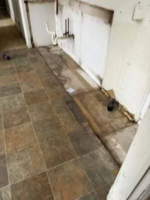 Interior concrete floor preparation with leveling work in progress